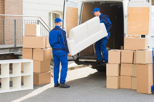 Removal team handling boxes in Blackheath residential move